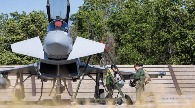 RAF personnel in uniform standing next to a Typhoon